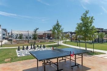 Outdoor games: life-sized chess board, ping pong table, cornhole